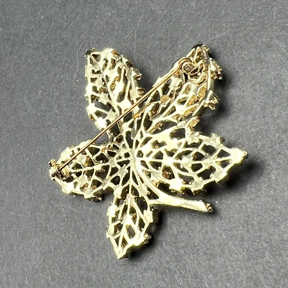 Gold Tone Leaf Brooch Red Rhinestone Accents Textured Openwork Vintage Style Pin
